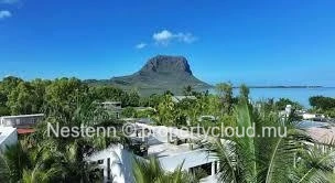 Commercial building with sea and mountain views.