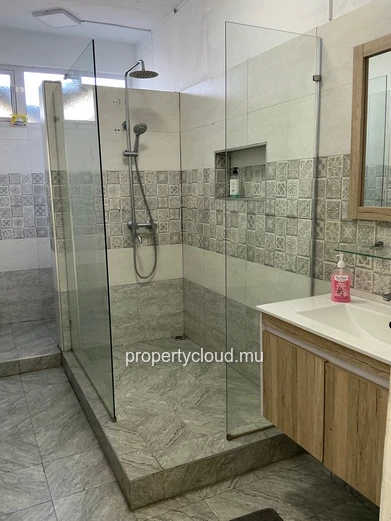 For sale in Mont Choisy, 300m from the beach. 4-bedroom villa + rooftop terrace. Reserved for local market - rare inv...