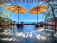 Stunning beachfront villa for rent at Roches Noires,  Fully furnished with elegance and style. 
