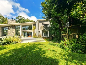 Nestled in the heart of Floreal, this architectural gem offers a modern lifestyle where nature is omnipresent and ill...