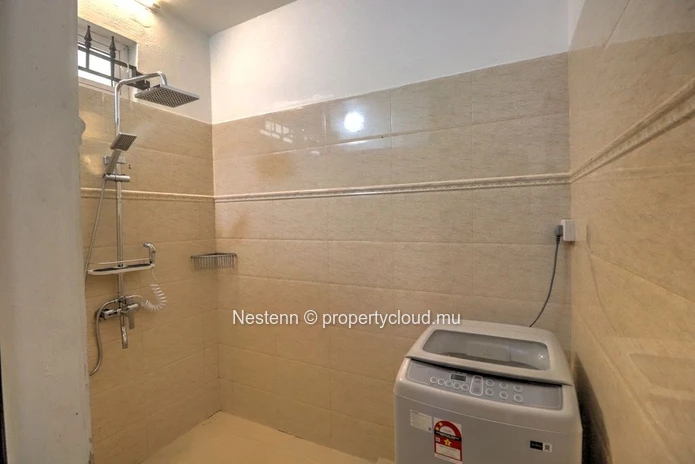 Spacious traditional triplex apartment in Grand Baie with 2 bedrooms, furnished, air conditioning, veranda, and close...