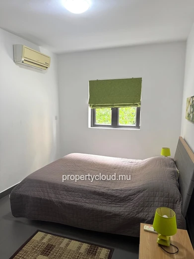 Flic en Flac à louer appartement 2 chambres situé dans une résidence sécurisée avec piscine, ascenseur et parking cou...
