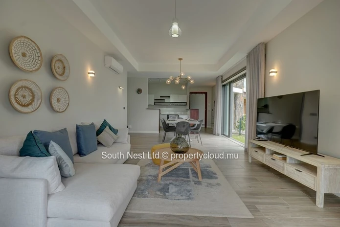 Elegant beachfront 3-bedroom apartment with private garden & direct beach access. 