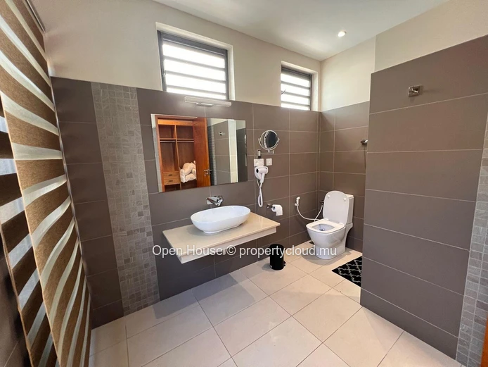 Architect-designed villa in Mon Choisy, featuring 4 bedrooms, 3 bathrooms, 1 office, and a swimming pool.