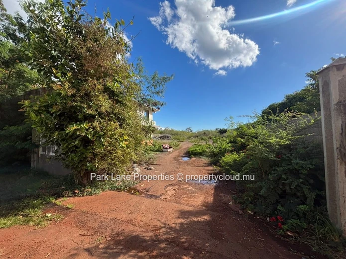 Expansive 8,847 m² Secured Plot with Building and Asphalted Area