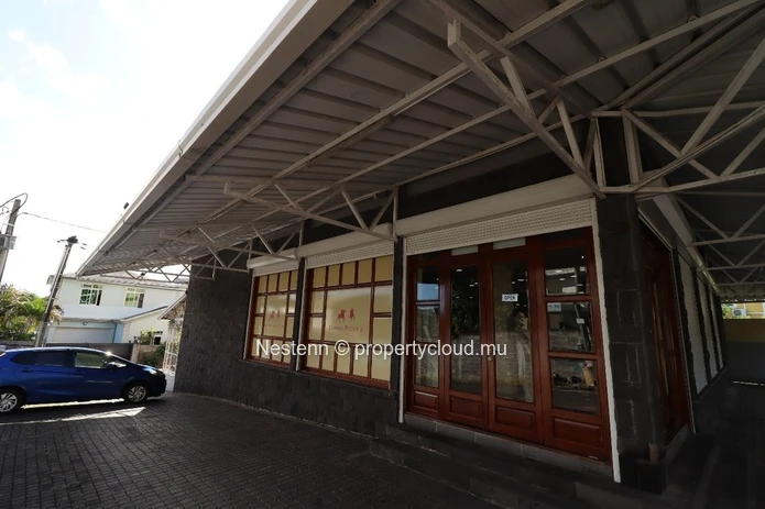 Commercial building with sea and mountain views.