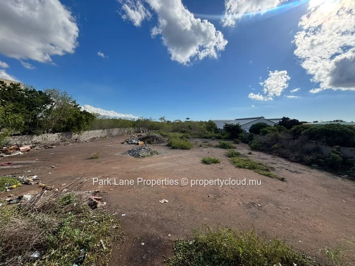 Expansive 8,847 m² Secured Plot with Building and Asphalted Area