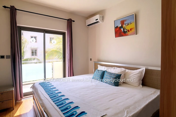 Duplex in residence with communal swimming pool