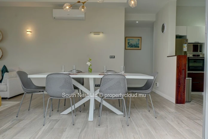 Elegant beachfront 3-bedroom apartment with private garden & direct beach access. 